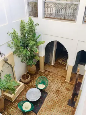 an overhead view of a living room with a table and a fireplace at Riad De Vinci & SPA in Marrakech