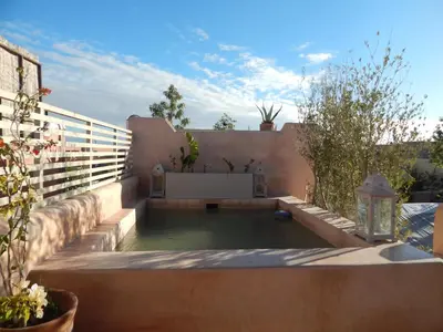 a swimming pool in the backyard of a house at Riad De Vinci & SPA in Marrakech