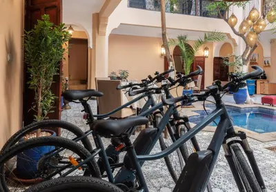 a group of bikes parked next to a pool at Riad Dar El Médina - Heated Swimming pool, jacuzzi & Spa in Marrakech