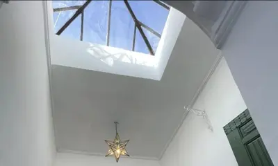 a ceiling with a window and a star in a room at Riad Privé Dar Yaël in Marrakech