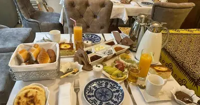 a table with breakfast foods and drinks on it at RIAD LUXE LOCATION le GRIZZLY in Marrakech