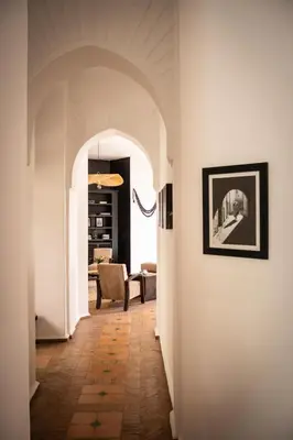 a hallway with an archway leading to a living room at Villa Al Assala Palmeraie in Marrakech