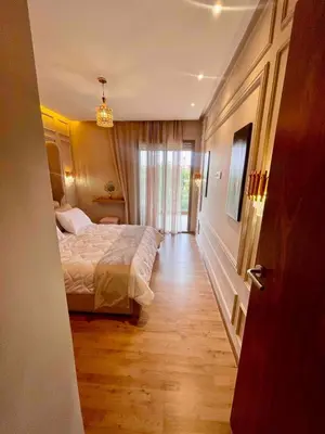 a hotel room with a bed and a hallway at Garden Marrakech Luxury in Marrakech