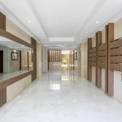 a hallway of a building with wooden lockers at Garden Marrakech Luxury in Marrakech