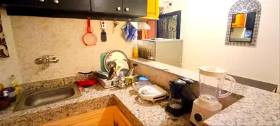 a kitchen counter top with a sink and a sink at Studio l'Oasis de la Palmeraie in Marrakech