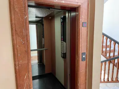 a door leading into a hallway with a staircase at Appartement Chic Gueliz Plaza avec Vue in Marrakech