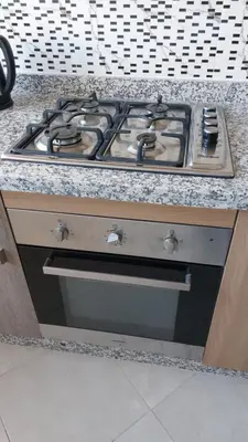 a stove top oven sitting in a kitchen at New Apartment in Marrakesh Guliz in Marrakech