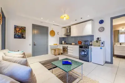 a living room with a couch and a table at Charming Cozy 2 Bedrooms central Gueliz in Marrakech