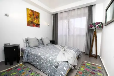 a bedroom with a bed and a window at Charming Cozy 2 Bedrooms central Gueliz in Marrakech