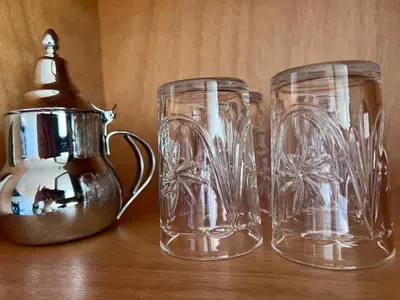 three clear glass vases sitting on top of a table at GUELIZ, majorelle, Beautiful apartment with large terrace in Marrakech