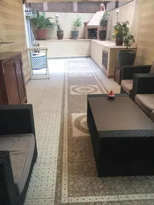 a living room with couches and a table at GUELIZ, majorelle, Beautiful apartment with large terrace in Marrakech
